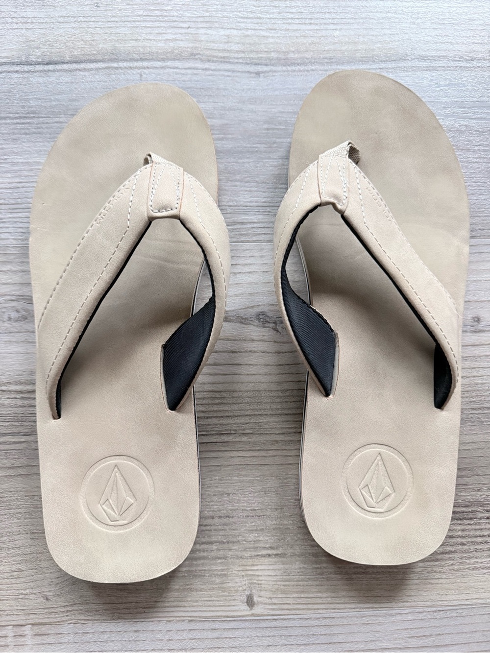 Men’s tan Volcom flip flops